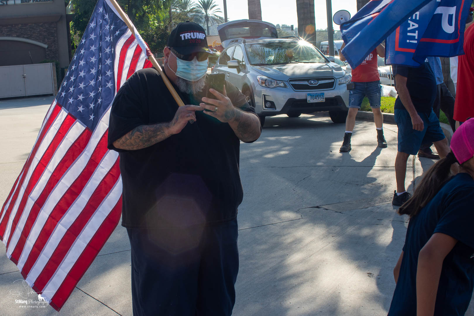 Ronnie Tagle walked and waved his large American flag at a Rally in support of president Trump on October 18, 2020 in La Habra, California. 