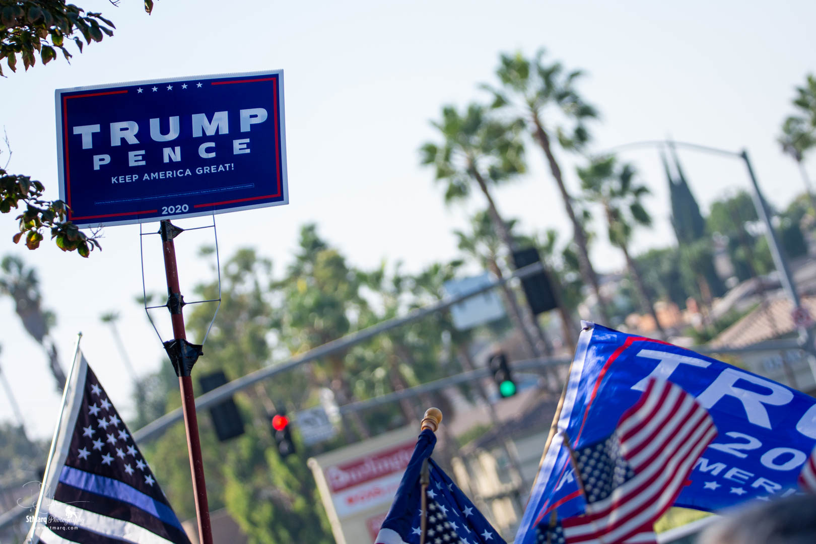 Backers of president Trump hold flags to show their support on the corner of Beach Blvd. and Imperial Highway in La Habra, CA on Sunday, October 18, 2020. They were attempting to show that California has supporters of the president even though it is usually written off as a Democrat stronghold.