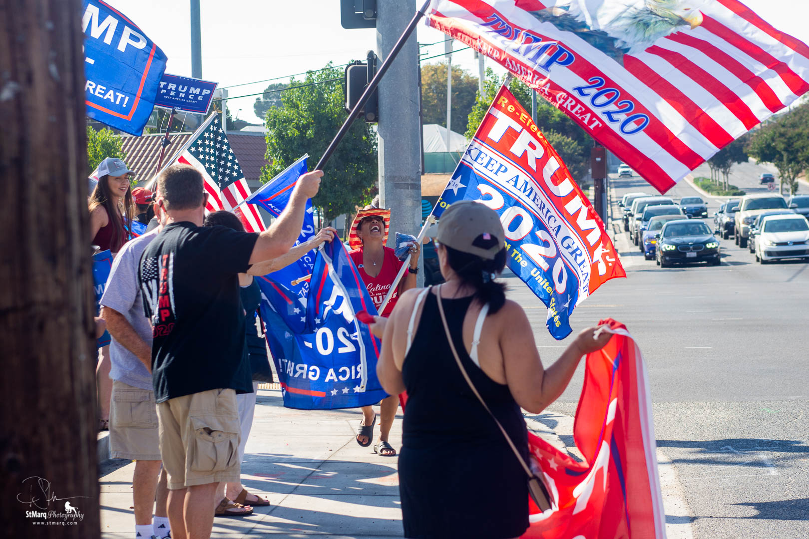 Backers of president Trump hold flags to show their support on the corner of Beach Blvd. and Imperial Highway in La Habra, CA on Sunday, October 18, 2020. They were attempting to show that California has supporters of the president even though it is usually written off as a Democrat stronghold.